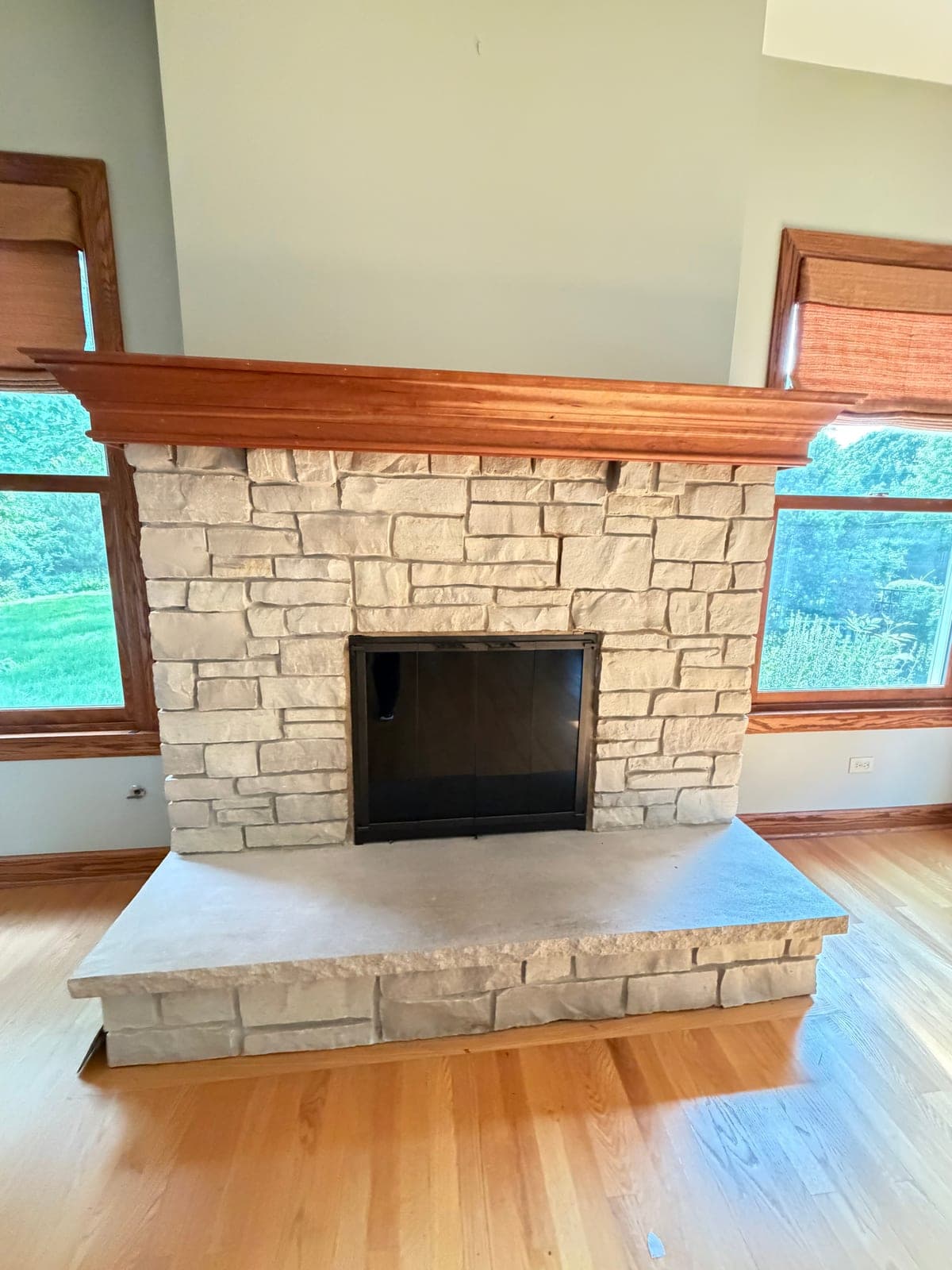 Stone Veneer Fireplace Surround w/ Wood Mantel & Glass Doors